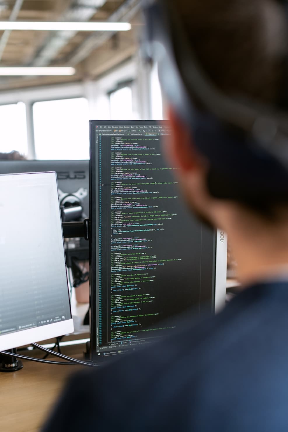 programmer with vertical monitor